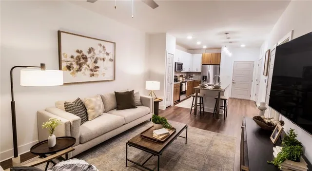 a living room with furniture and a flat screen tv