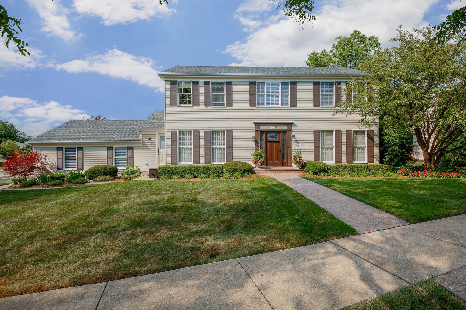230 Hill Road Willowbrook, IL 60527 - Photo 2 of 39 front view of a house with a yard