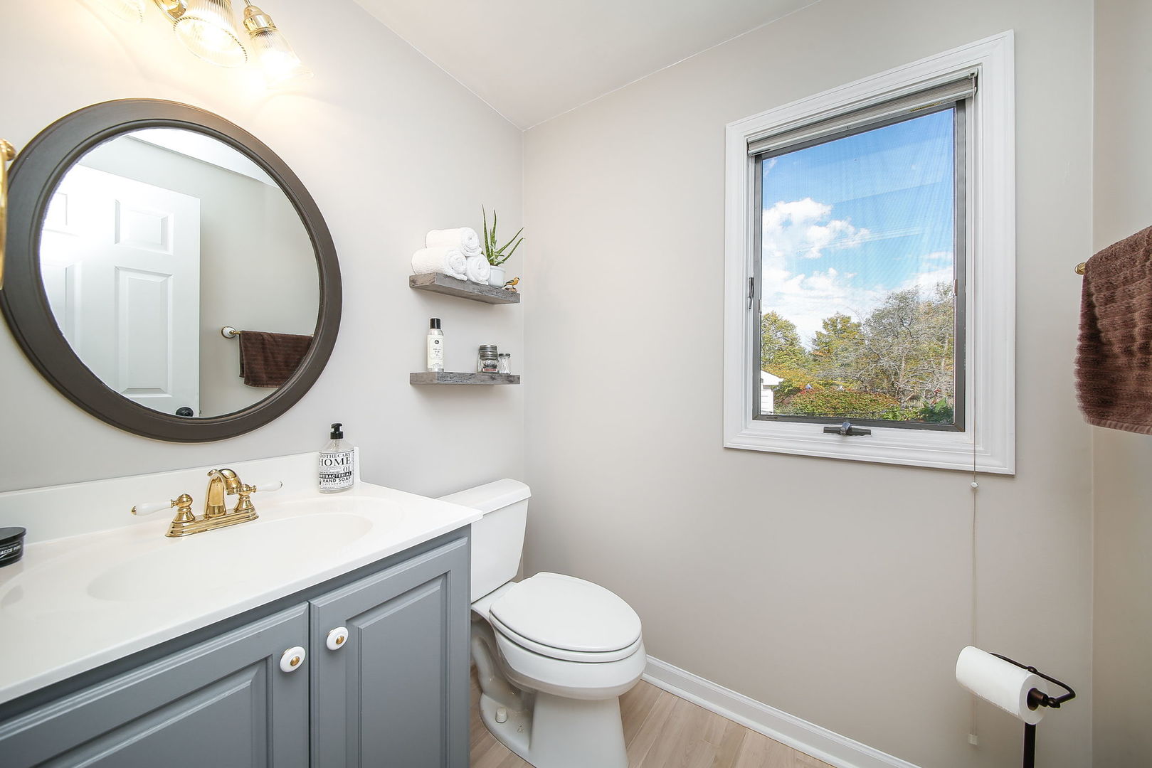 230 Hill Road Willowbrook, IL 60527 - Photo 14 of 39 a bathroom with a toilet a sink and mirror