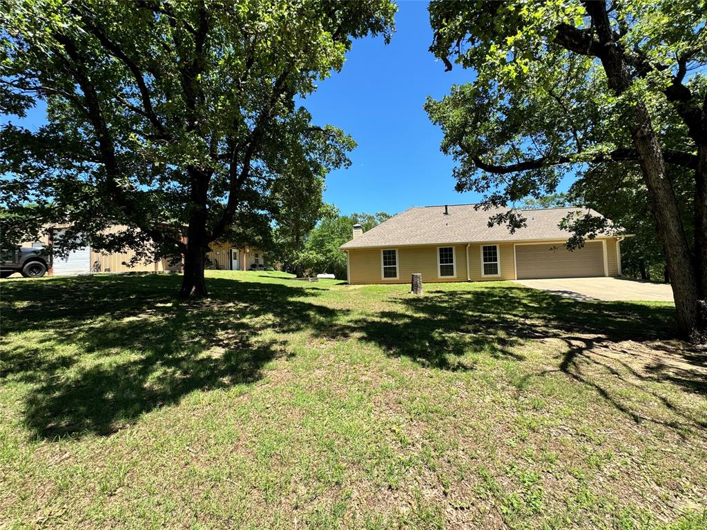 8636 Highway 31 Athens, TX 75751 - Photo 16 of 22 a front view of a house with a yard