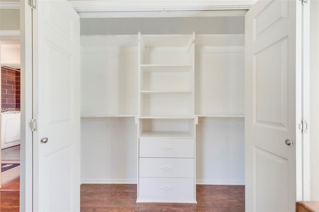 8636 Highway 31 Athens, TX 75751 - Photo 8 of 22 a view of walk in closet with empty racks