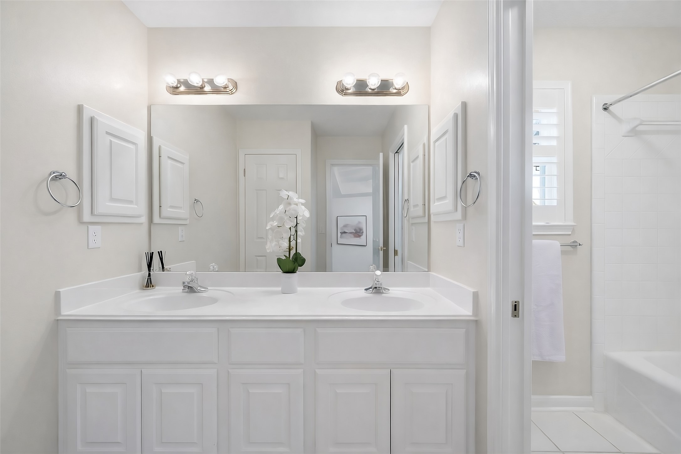 5100 Hadle Cove Austin, TX 78730 - Photo 18 of 31 The upstairs full bathroom with a double sink vanity, linen closet, and separate shower/toilet area. Virtually Painted to show what it could look like with paint.