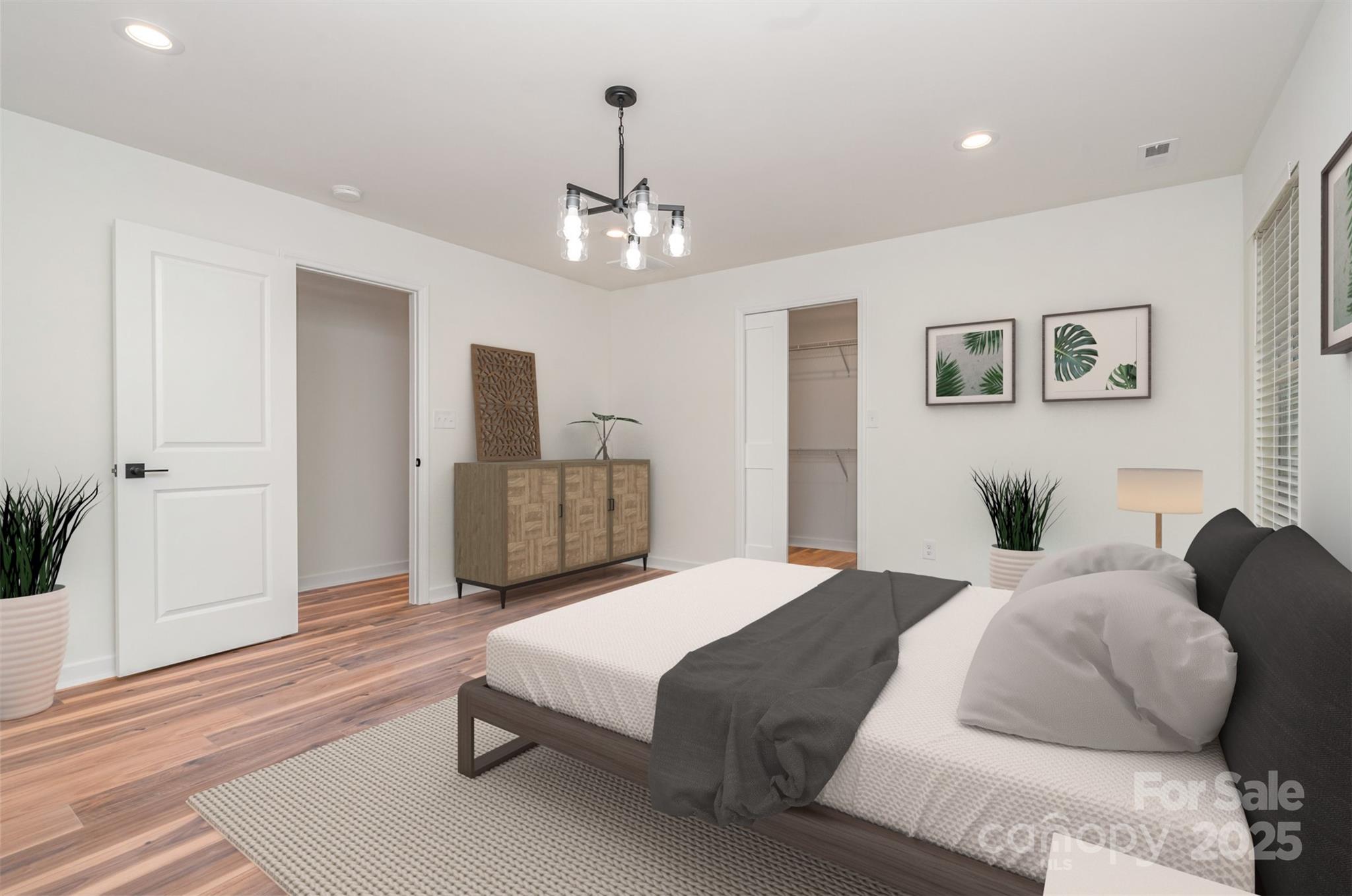 4169 Stack Road Harrisburg, NC 28075 - Photo 13 of 29 a spacious bedroom with a bed and ceiling fan