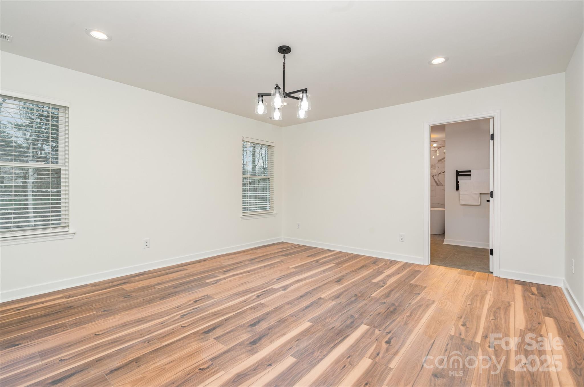 4169 Stack Road Harrisburg, NC 28075 - Photo 15 of 29 a view of empty room with wooden floor and window