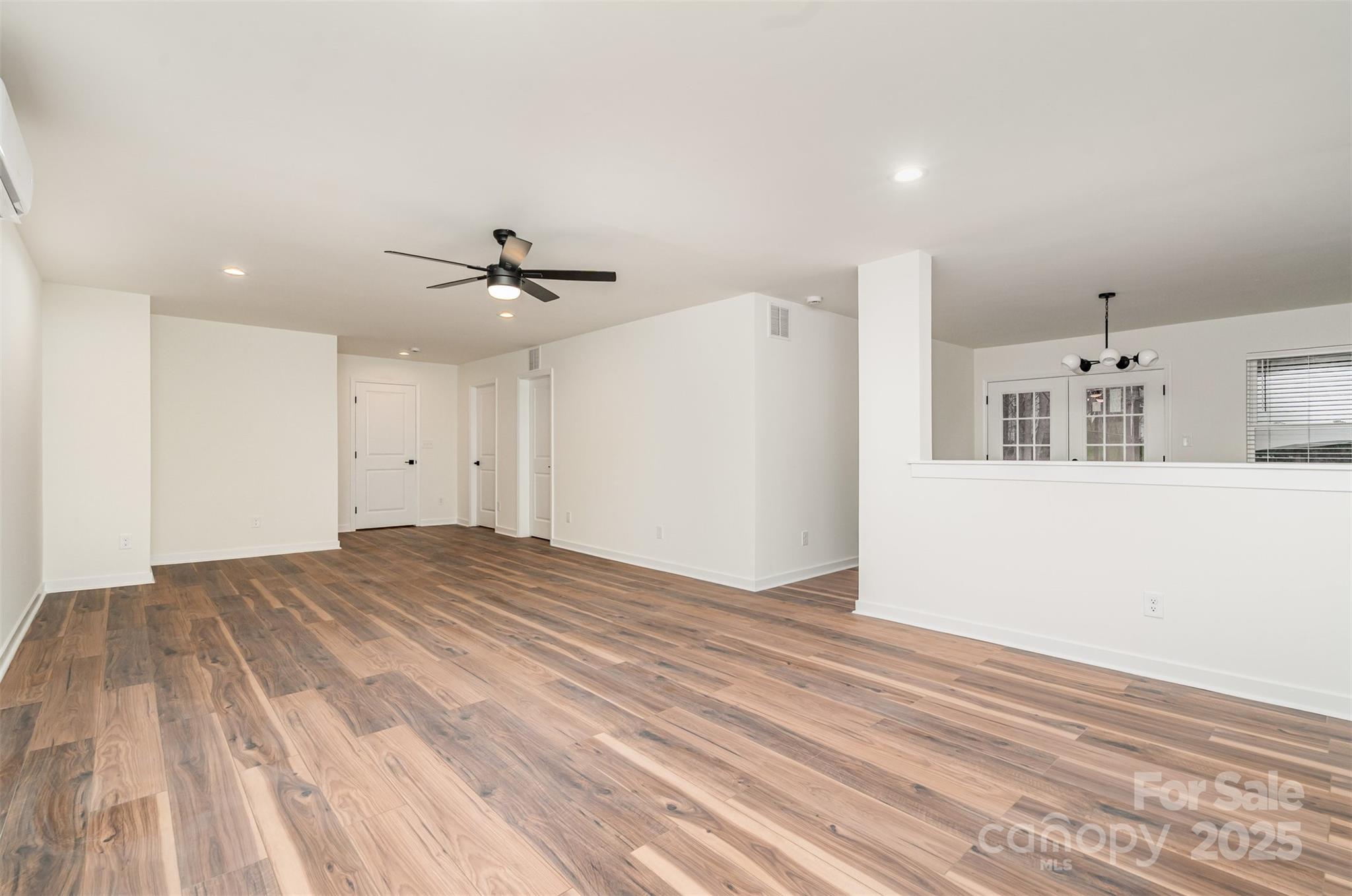4169 Stack Road Harrisburg, NC 28075 - Photo 20 of 29 a view of a livingroom with a ceiling fan