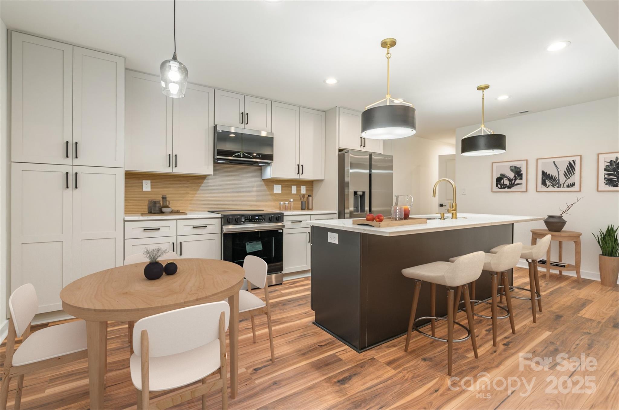 4169 Stack Road Harrisburg, NC 28075 - Photo 2 of 29 a kitchen with a dining table chairs stainless steel appliances and cabinets
