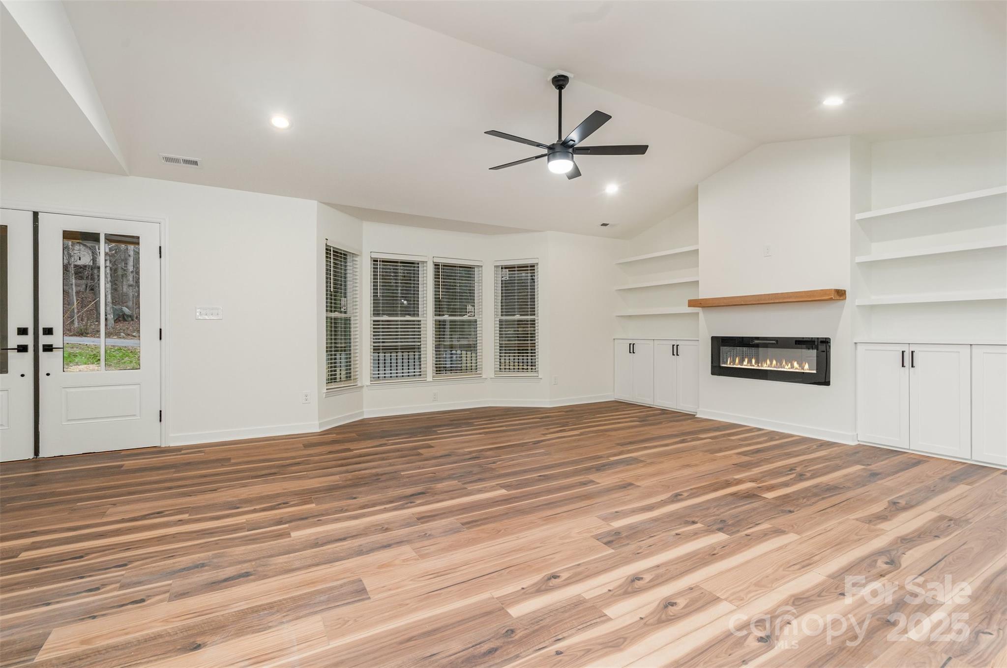 4169 Stack Road Harrisburg, NC 28075 - Photo 5 of 29 a bedroom with a bed and a ceiling fan