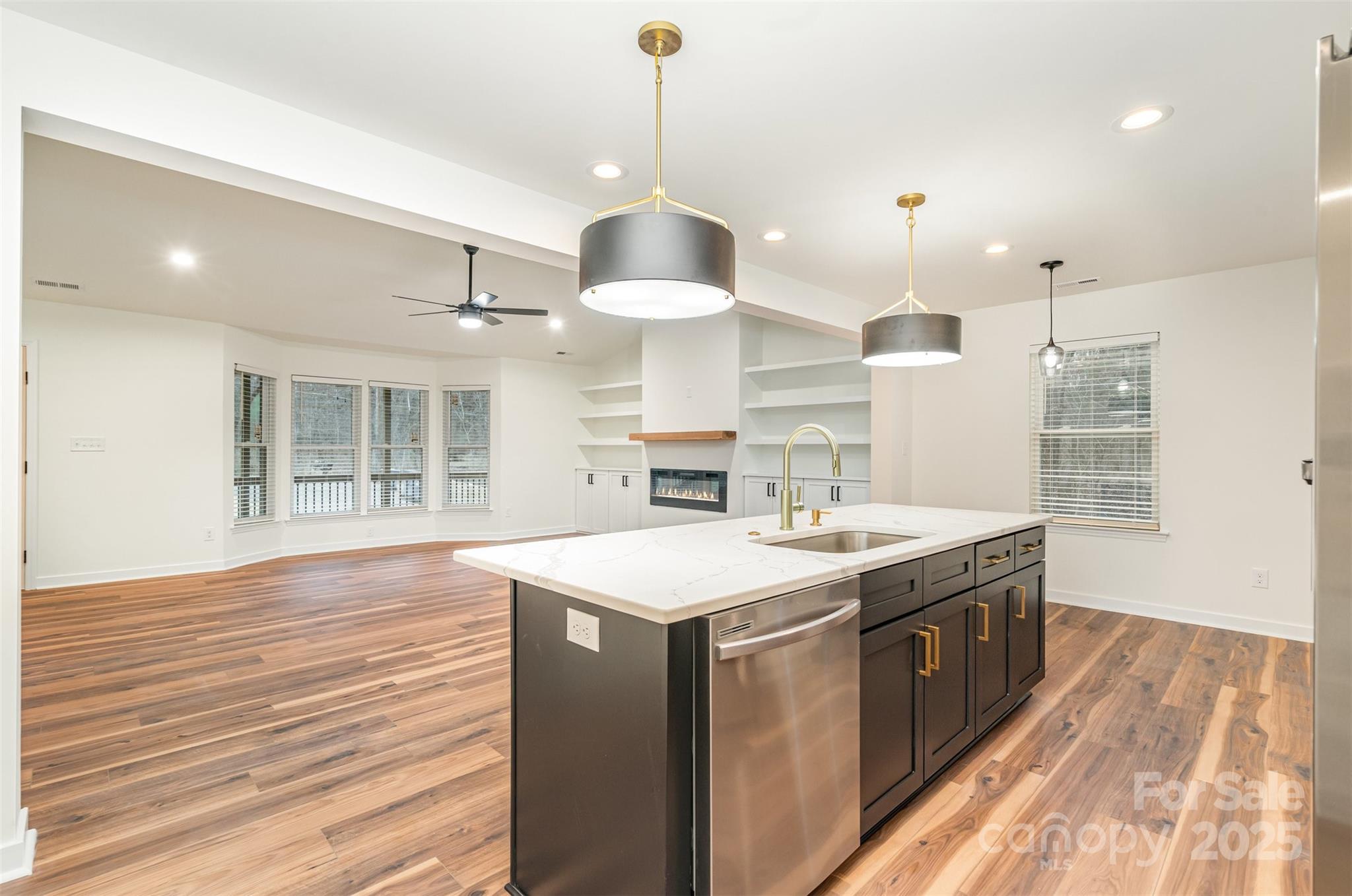 4169 Stack Road Harrisburg, NC 28075 - Photo 7 of 29 a kitchen with a stove and a wooden floors