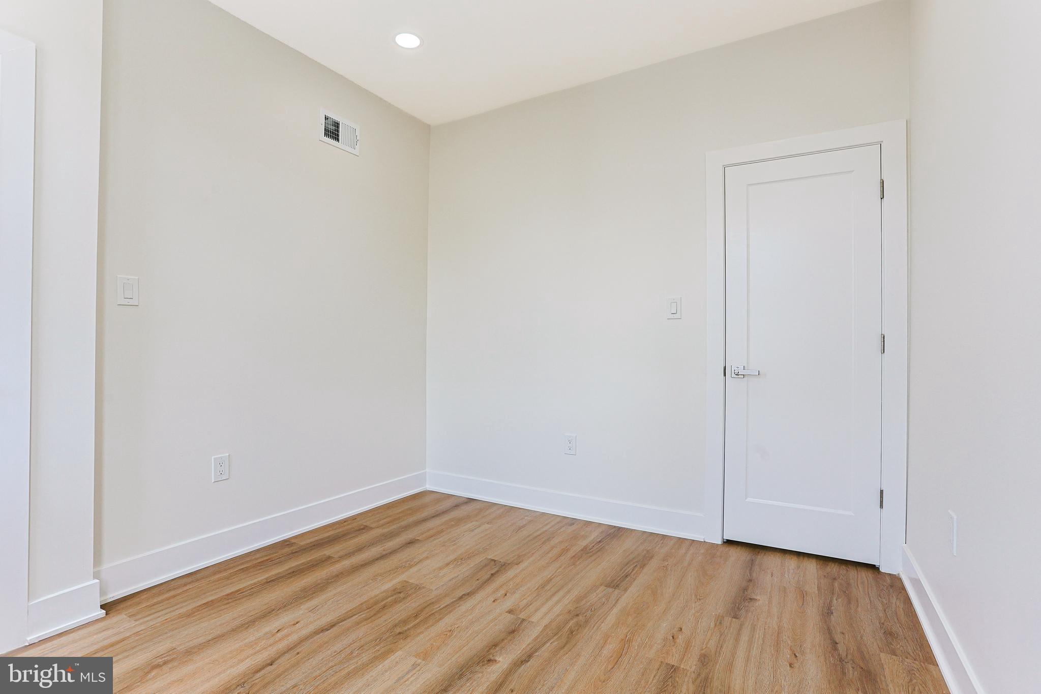 5520 Pemberton Street Philadelphia, PA 19143 - Photo 14 of 28 a view of an empty room with wooden floor