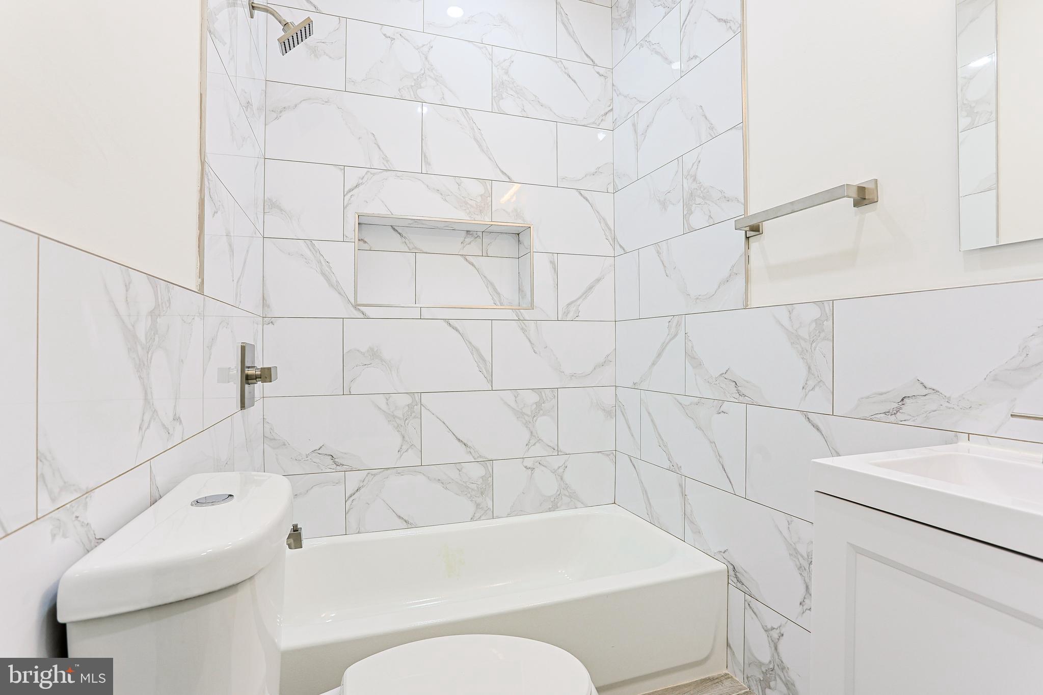 5520 Pemberton Street Philadelphia, PA 19143 - Photo 15 of 28 a bathroom with a bathtub and sink