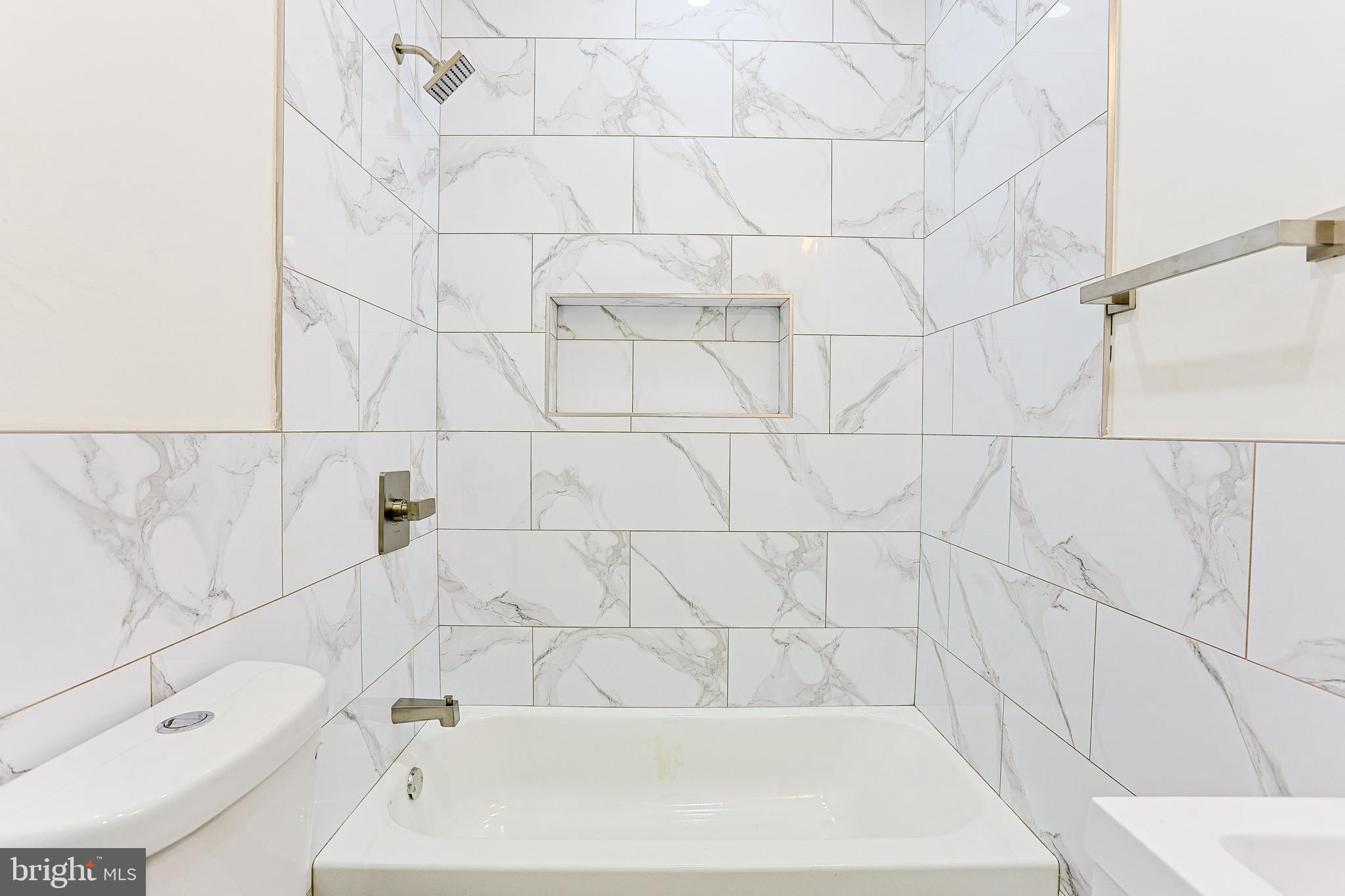 5520 Pemberton Street Philadelphia, PA 19143 - Photo 17 of 28 a bathroom with a bathtub and shower