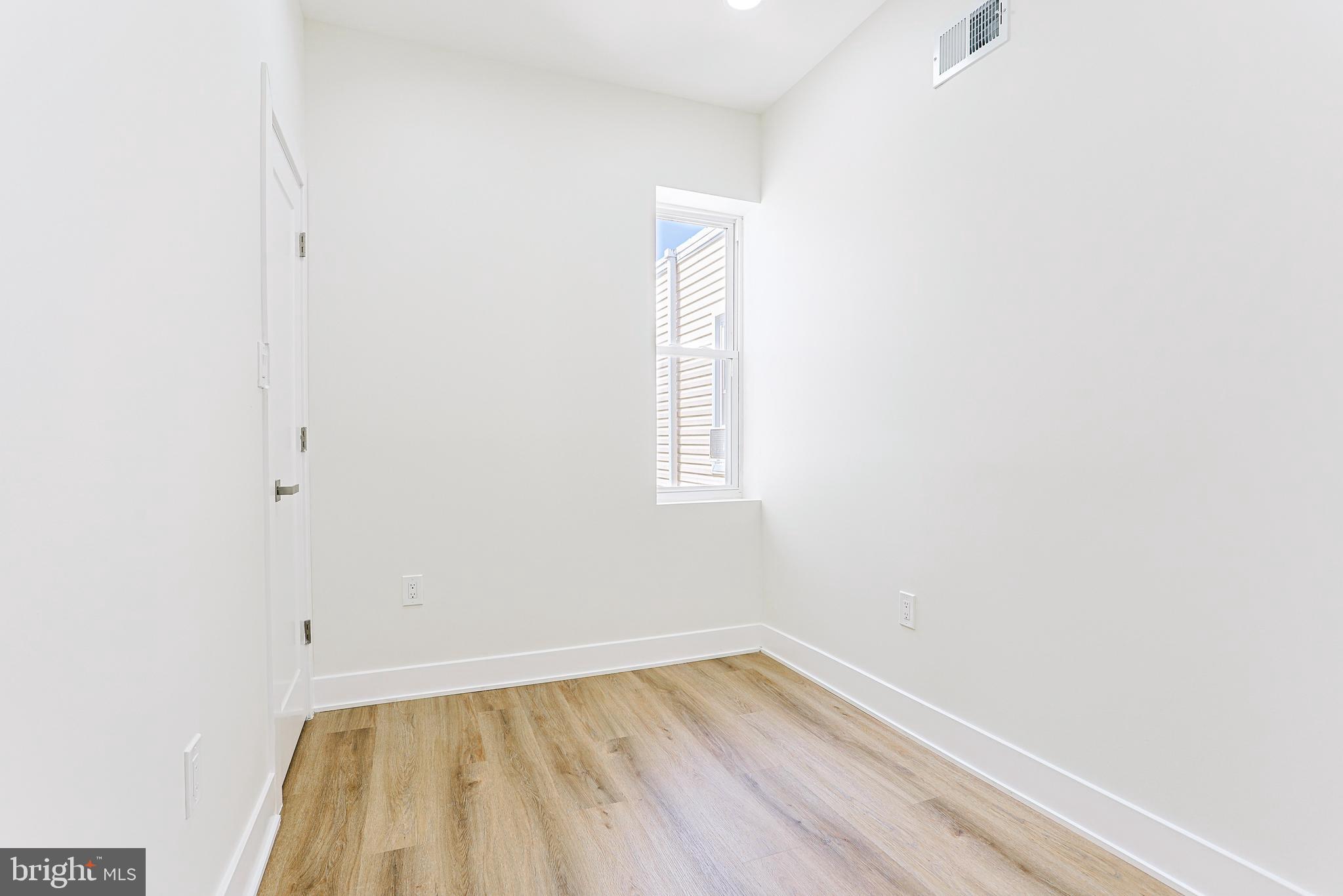 5520 Pemberton Street Philadelphia, PA 19143 - Photo 18 of 28 a view of a small space with wooden floor and a window