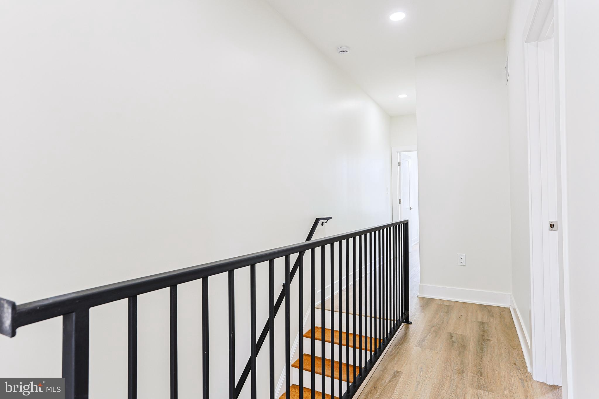 5520 Pemberton Street Philadelphia, PA 19143 - Photo 24 of 28 a view of a hallway with wooden floor