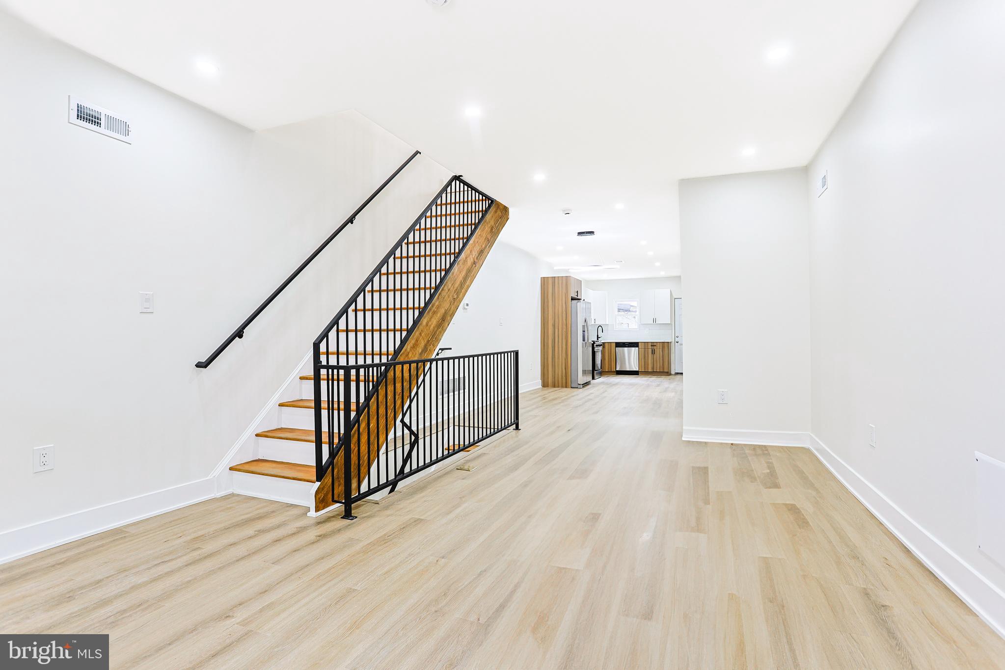 5520 Pemberton Street Philadelphia, PA 19143 - Photo 7 of 28 a view of a hallway with wooden floor and staircase