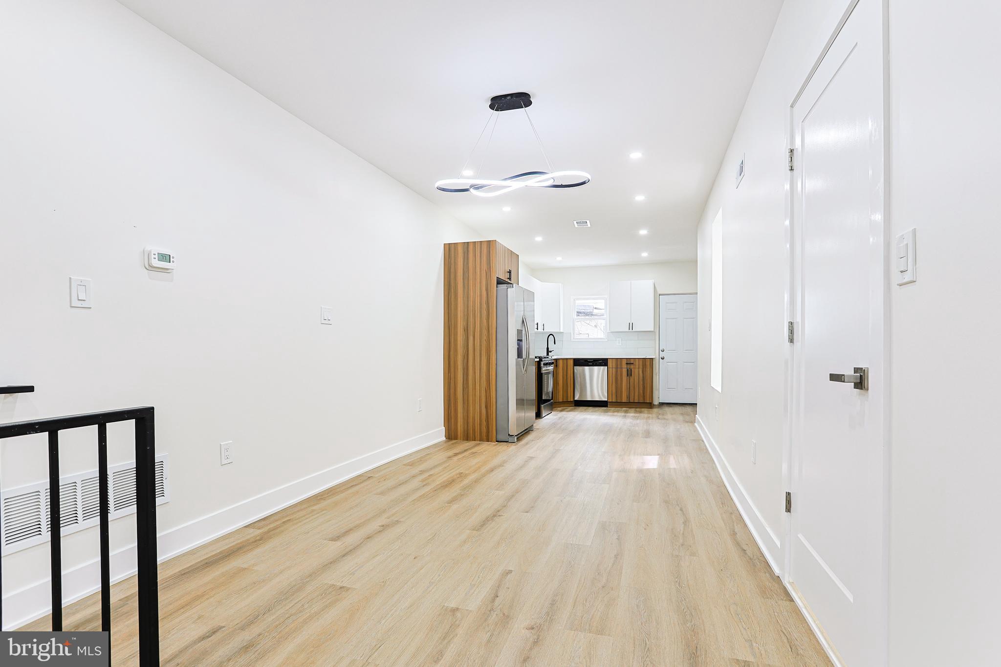 5520 Pemberton Street Philadelphia, PA 19143 - Photo 8 of 28 a view of a hallway with wooden floor