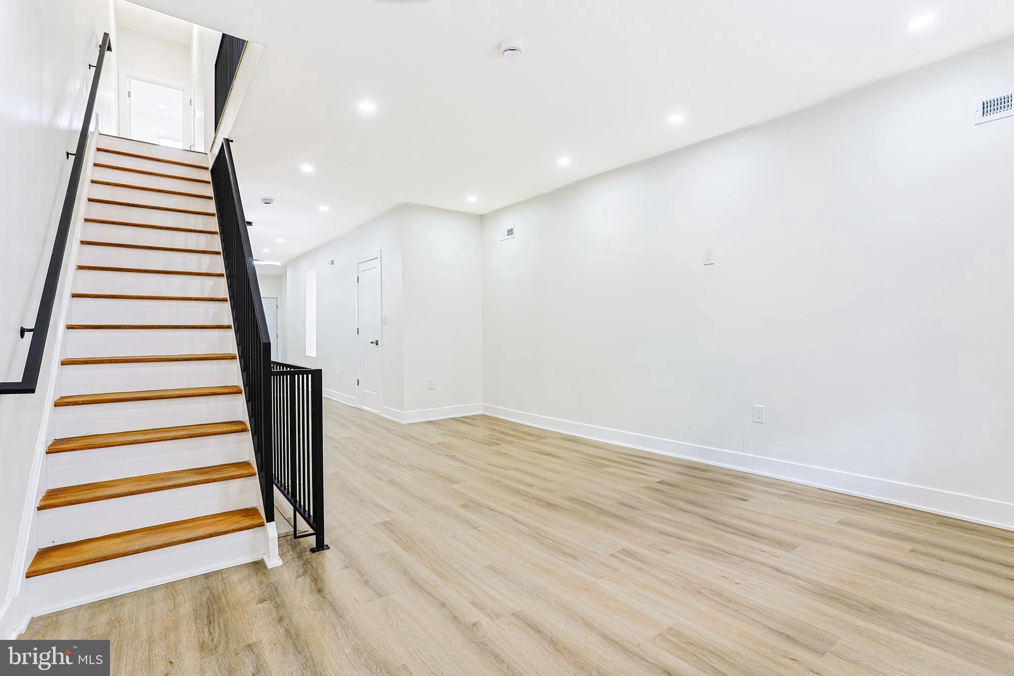5520 Pemberton Street Philadelphia, PA 19143 - Photo 9 of 28 a view of a room with stairs and wooden floor