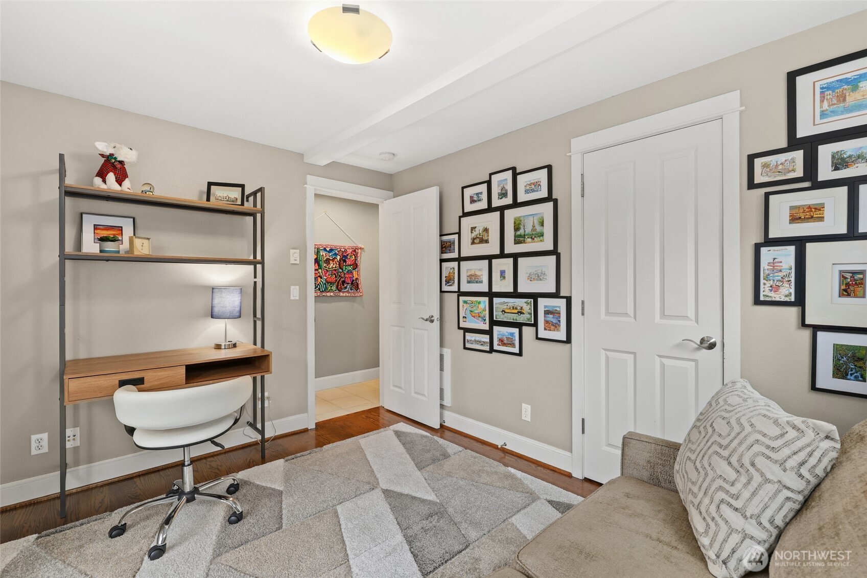 4535 Northeast 55th Street Seattle, WA 98105 - Photo 3 of 27 a living room with furniture and a painting on the wall