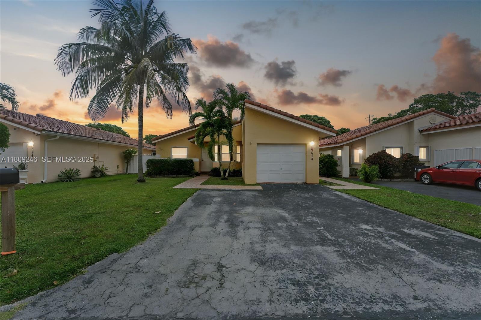 10813 Southwest 158th Lane Miami, FL 33157 - Photo 1 of 27 a front view of a house with a garden and yard