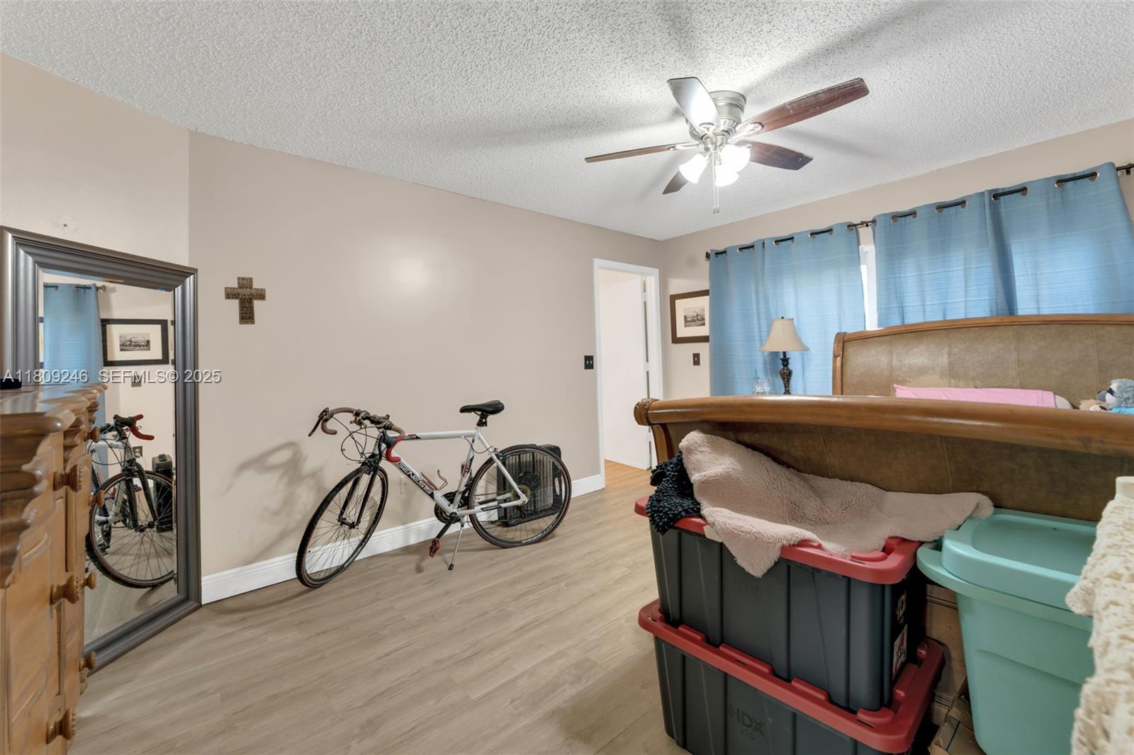 10813 Southwest 158th Lane Miami, FL 33157 - Photo 6 of 27 a bedroom with furniture and a ceiling fan