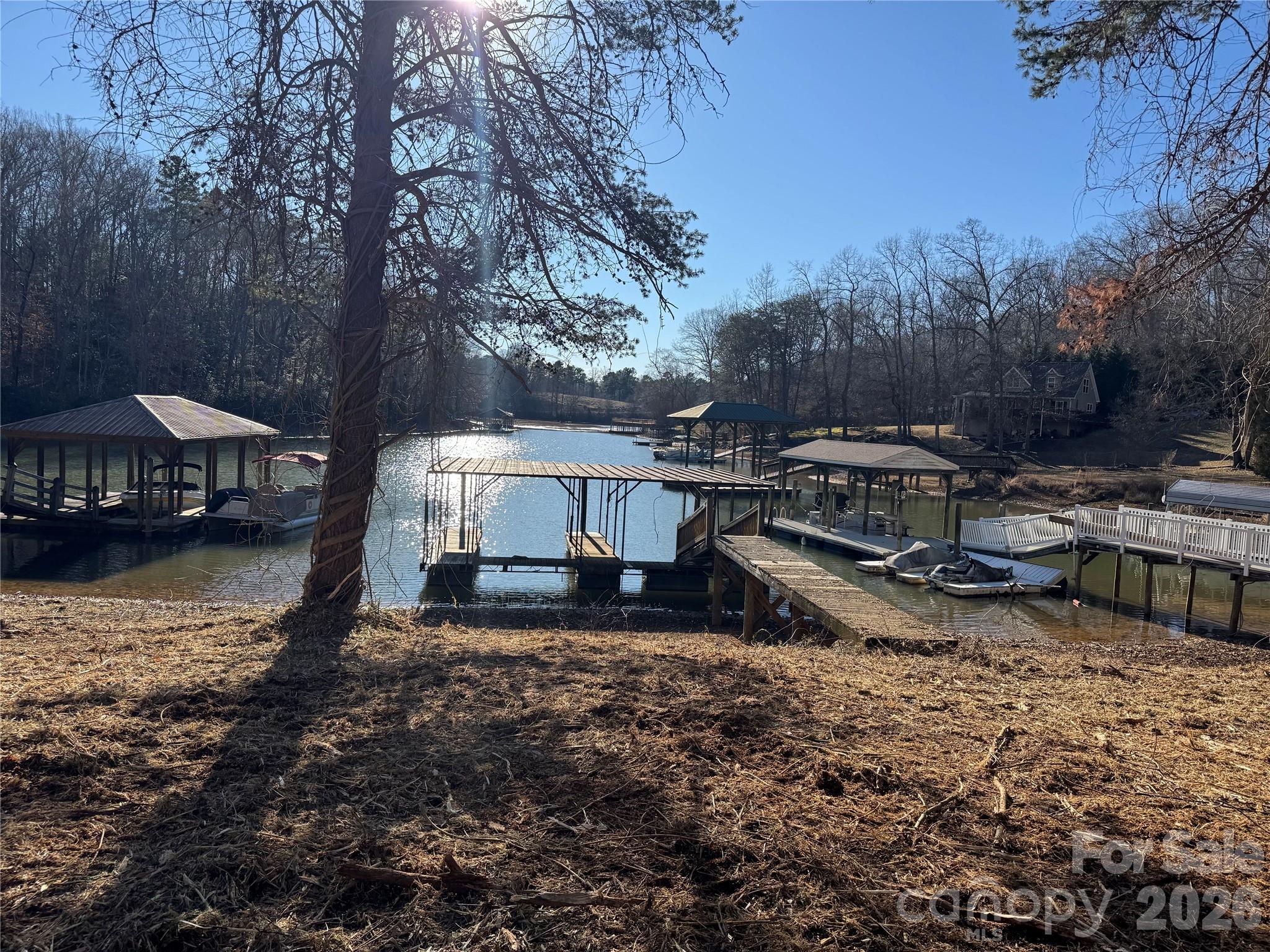 1308 Terrapin Ridge Road Catawba, NC 28609 - Photo 2 of 10 a view of a backyard with table and chairs under an umbrella
