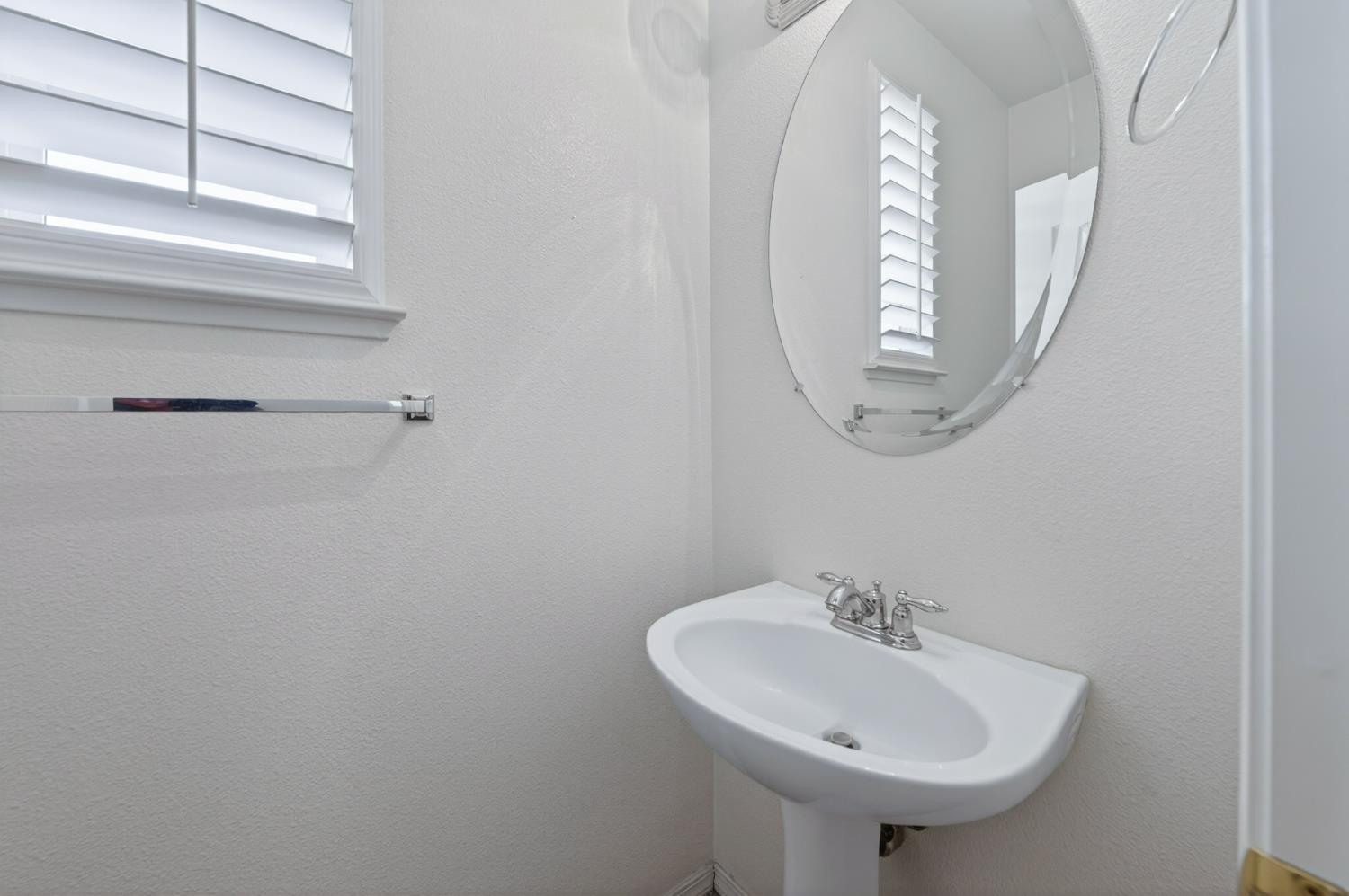 4113 West Cherry Tree Lane Fresno, CA 93722 - Photo 15 of 31 Half bath - down stairs
