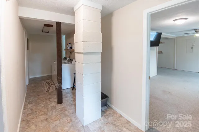 a patio with wooden floor a yard a table and chairs