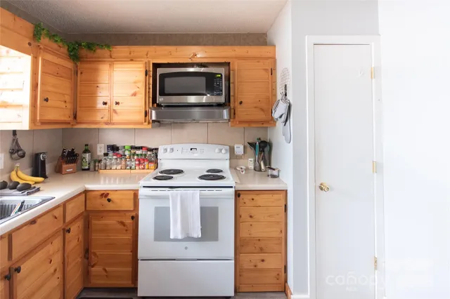 a kitchen with a stove and a microwave