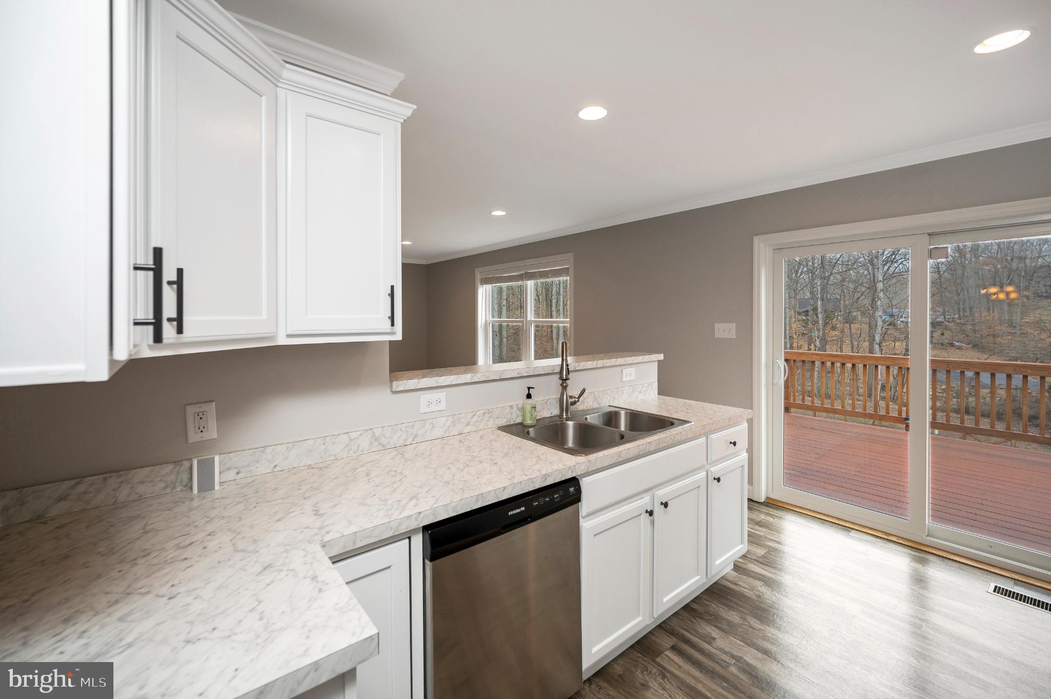 6112 Eds Road Mineral, VA 23117 - Photo 11 of 39 a kitchen with a sink and cabinets