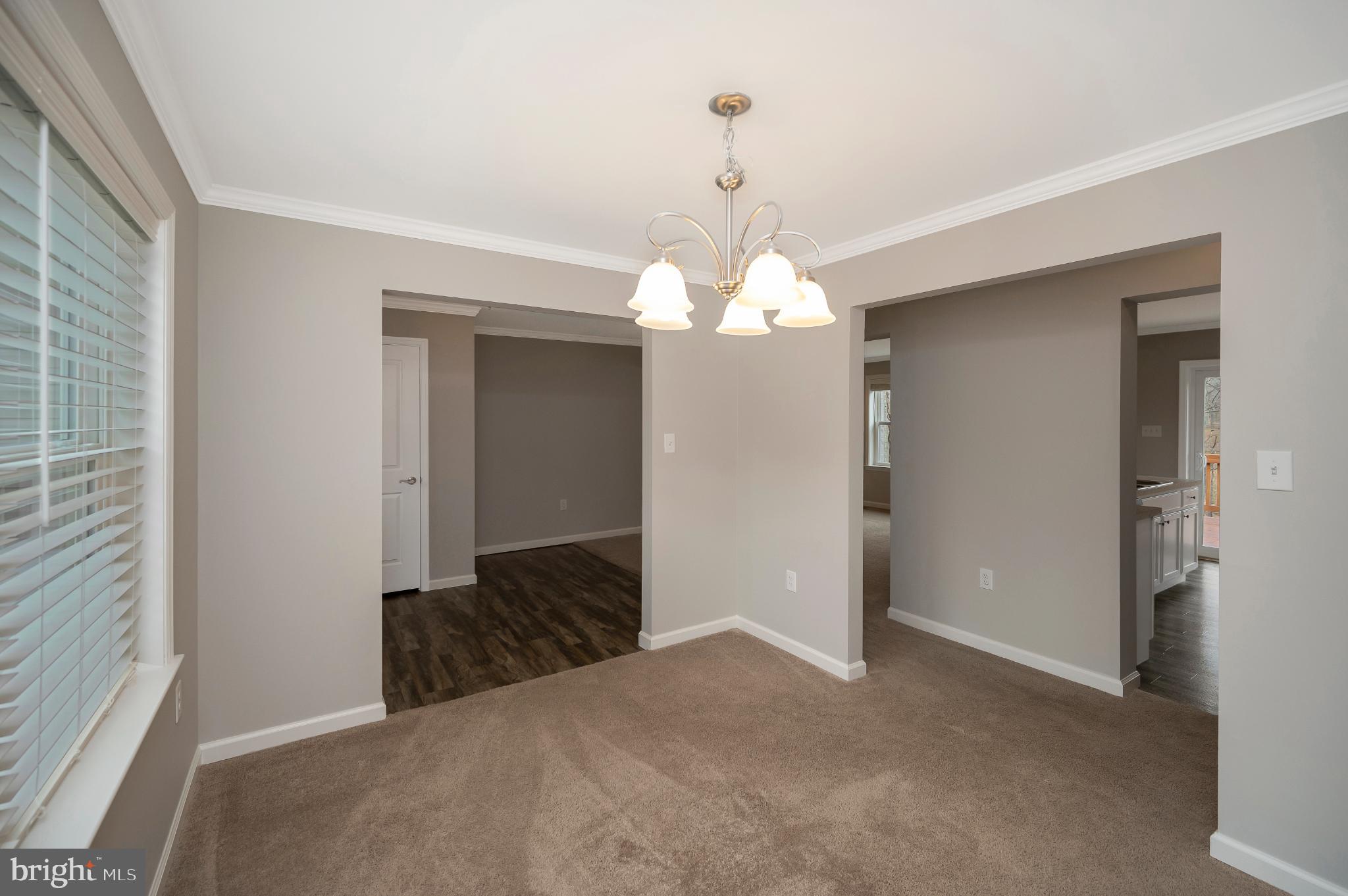 6112 Eds Road Mineral, VA 23117 - Photo 18 of 39 a view of a chandelier in hallway view with staircase