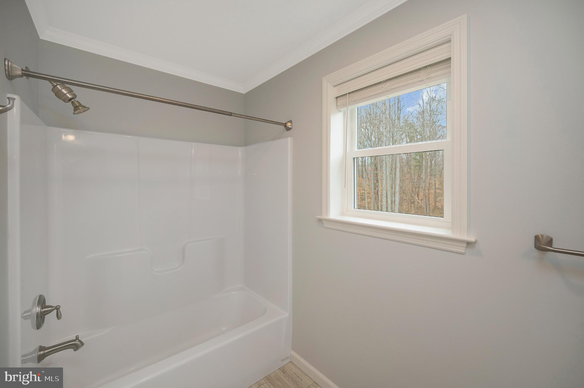 6112 Eds Road Mineral, VA 23117 - Photo 25 of 39 a bathroom with a shower and a window