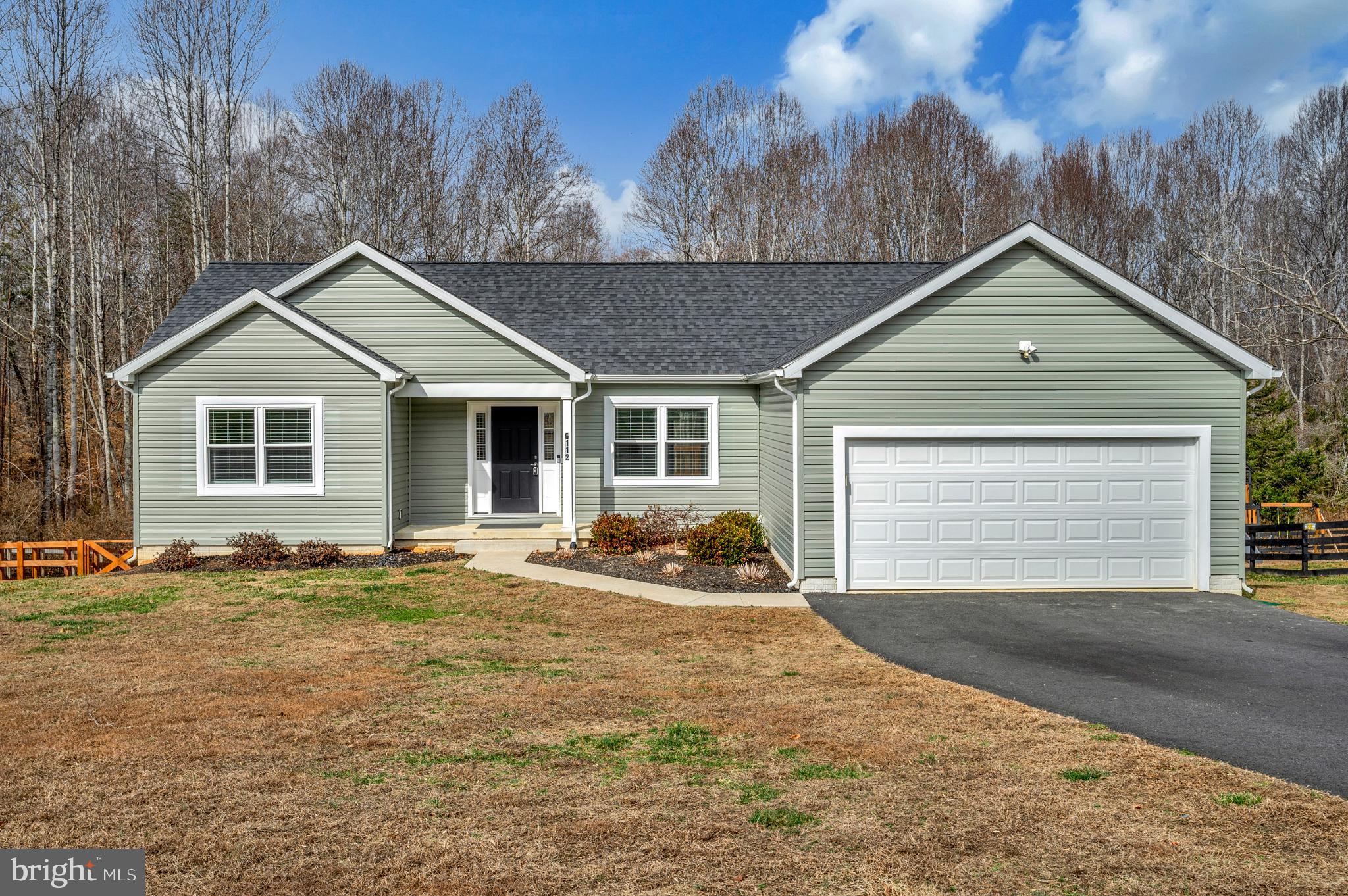 6112 Eds Road Mineral, VA 23117 - Photo 3 of 39 a front view of a house with a yard and trees