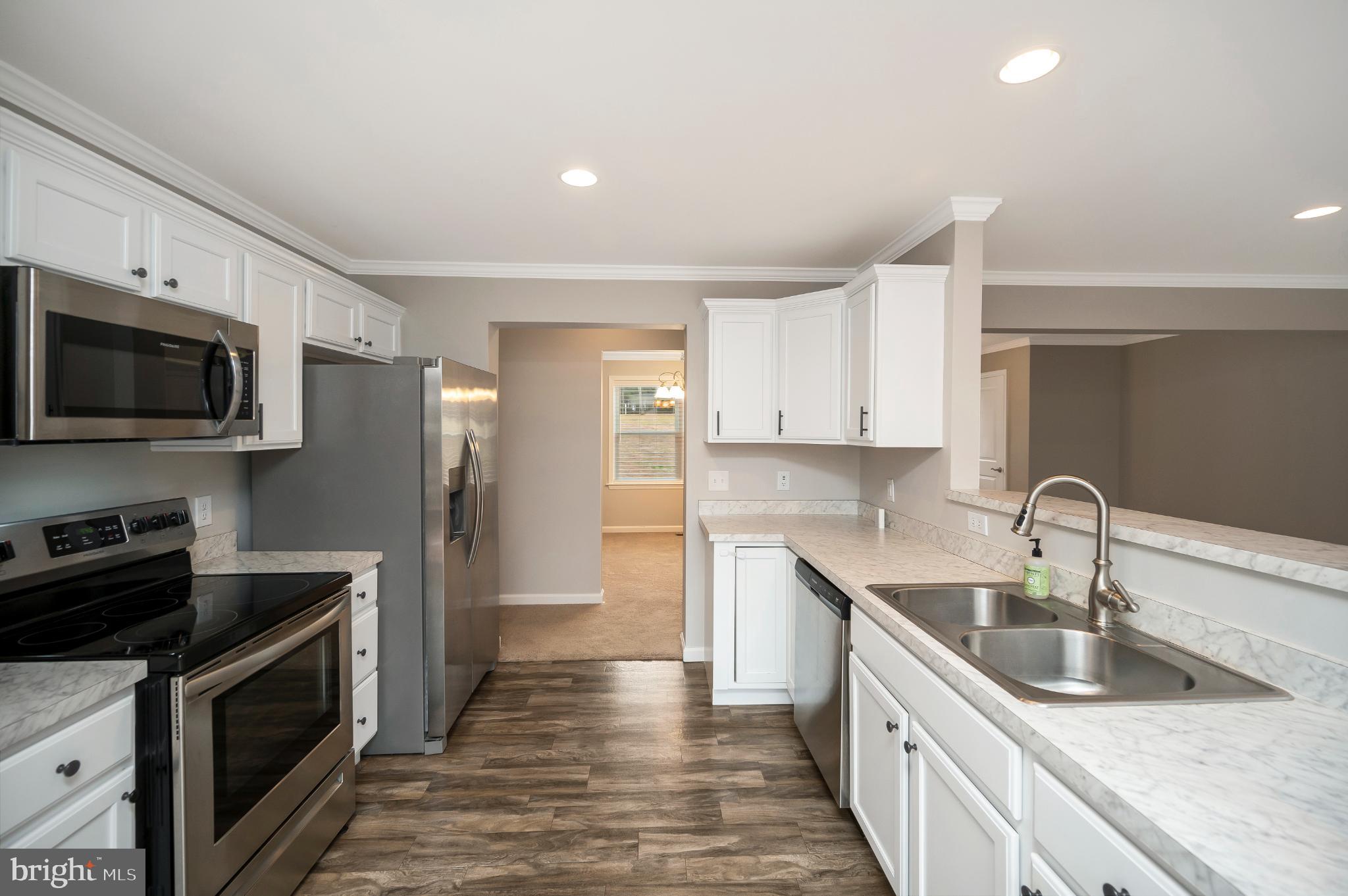 6112 Eds Road Mineral, VA 23117 - Photo 9 of 39 a kitchen with granite countertop a sink and steel appliances