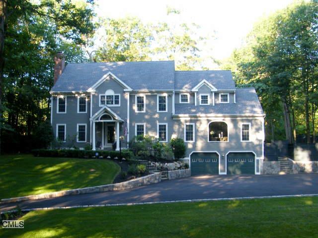 183 East Wilton Road Ridgefield, CT 06877 - Photo 1 of 1 a front view of a house with a yard and potted plants