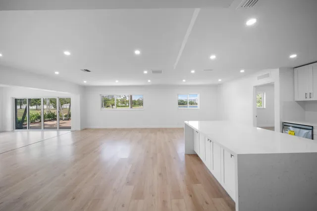 a view of kitchen with cabinets and wooden floor