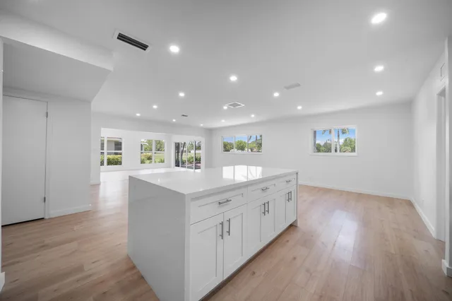 a view of kitchen with furniture and wooden floor