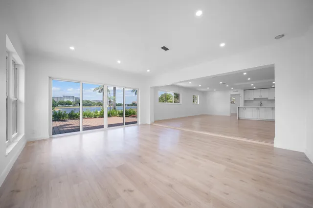 a view of an empty room with closet area