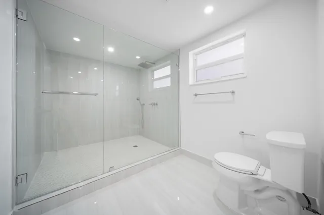 a picture of a bathroom with a window
