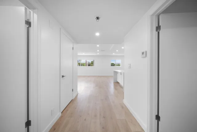 a kitchen with stainless steel appliances a stove microwave and sink