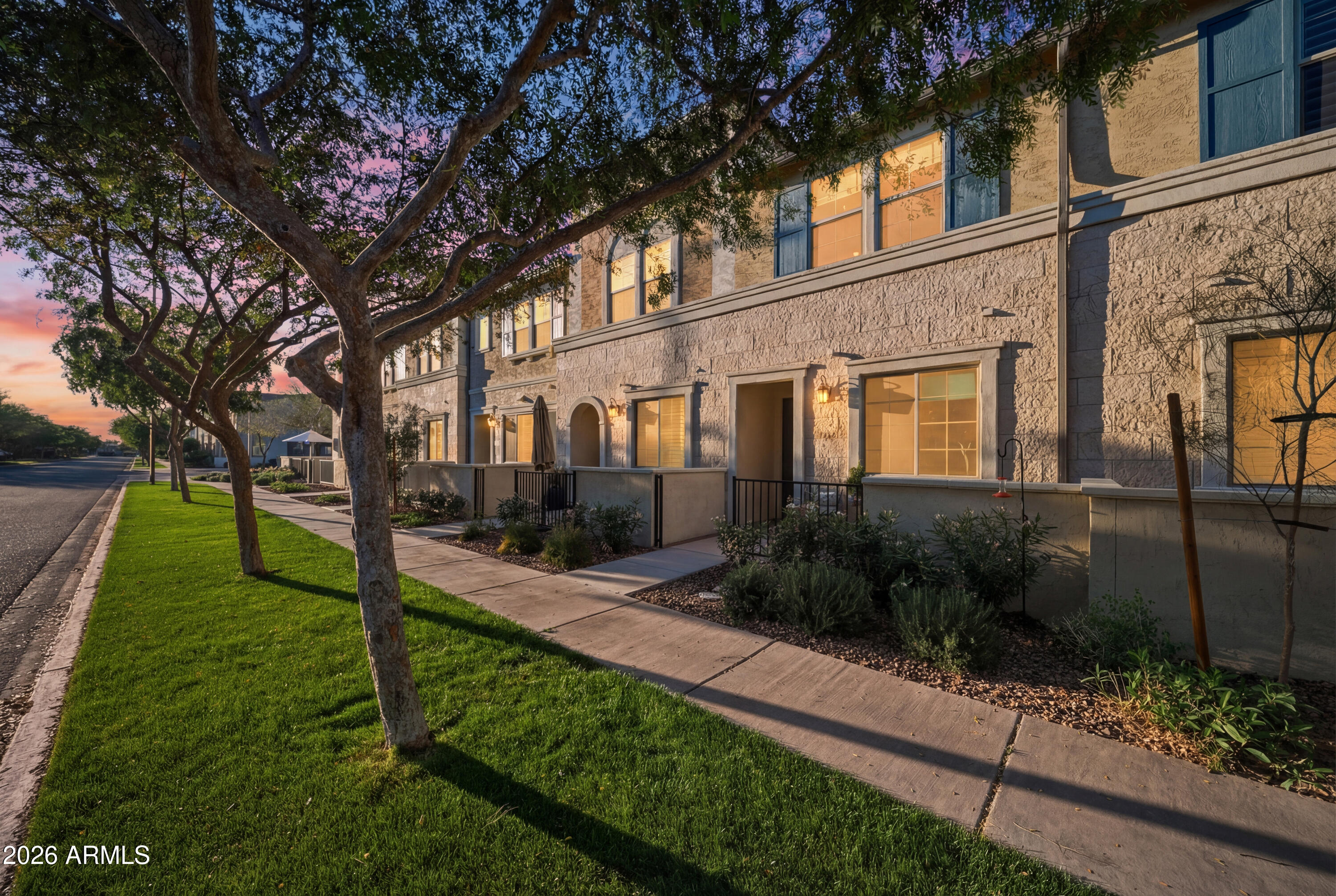 1917 East Hampton Lane, Unit 106 Gilbert, AZ 85295 - Photo 1 of 25 a view of a garden with a tree