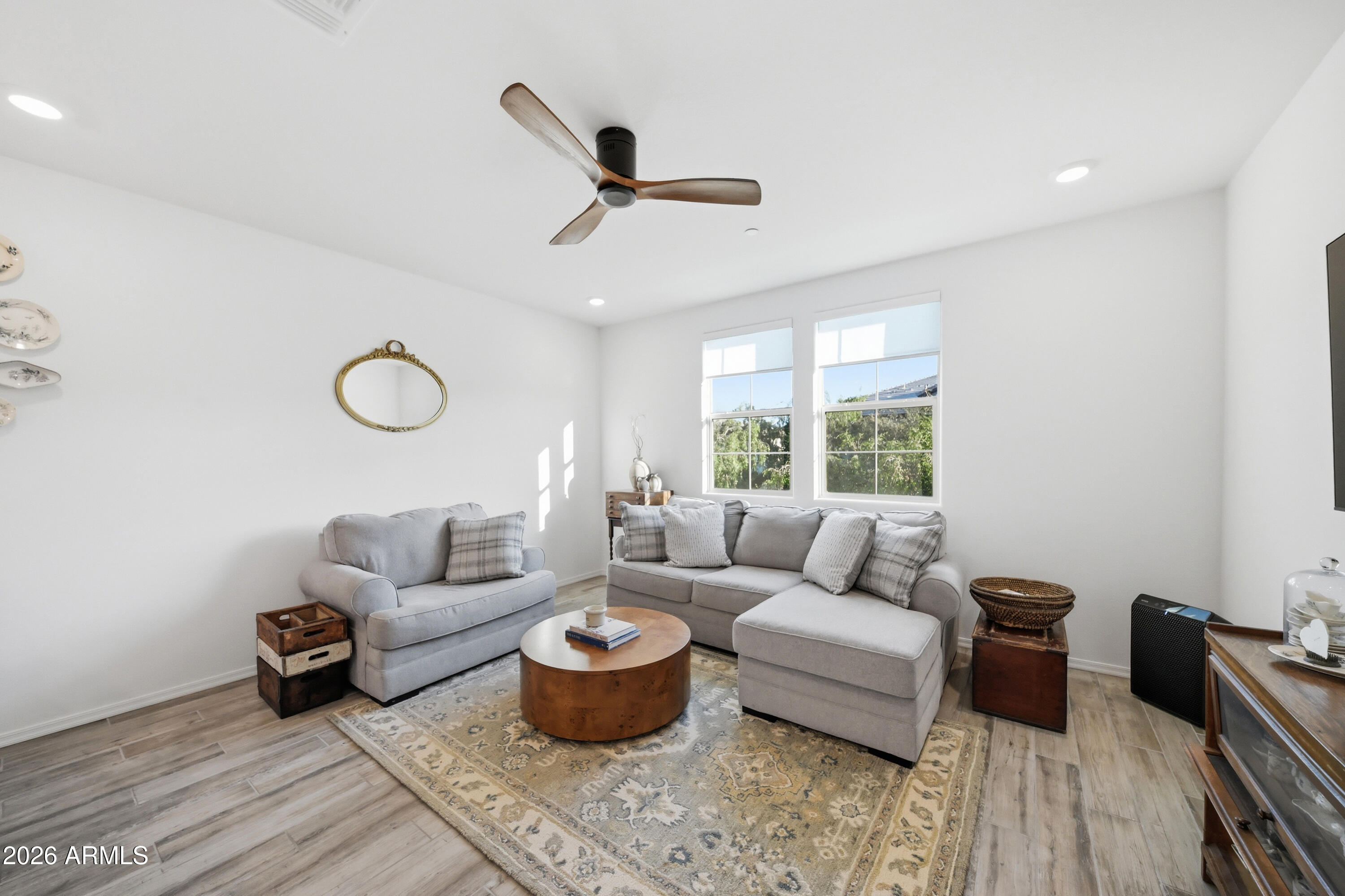 1917 East Hampton Lane, Unit 106 Gilbert, AZ 85295 - Photo 14 of 25 a living room with furniture and a large window