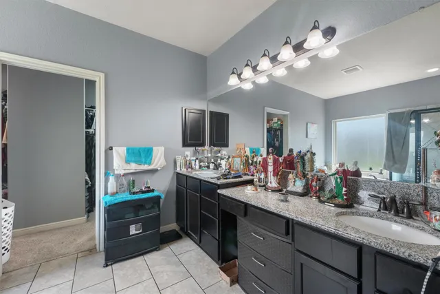 a kitchen with a sink and a stove top oven