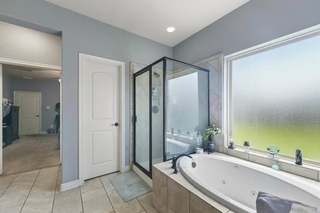 a bathroom with a bathtub and a sink