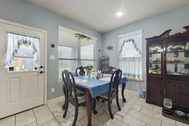a view of a dining room with furniture and window