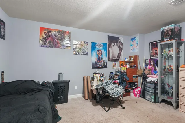 a bedroom with furniture and a bed