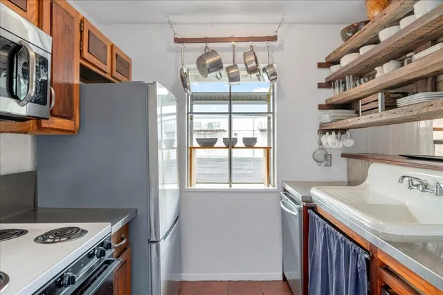 a kitchen with a stove and a sink