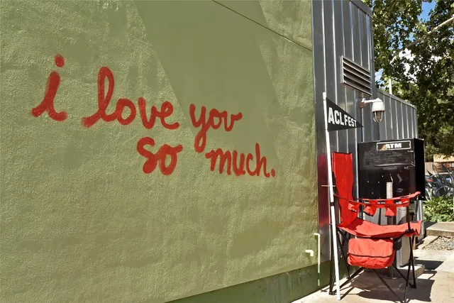 a street sign on a brick wall