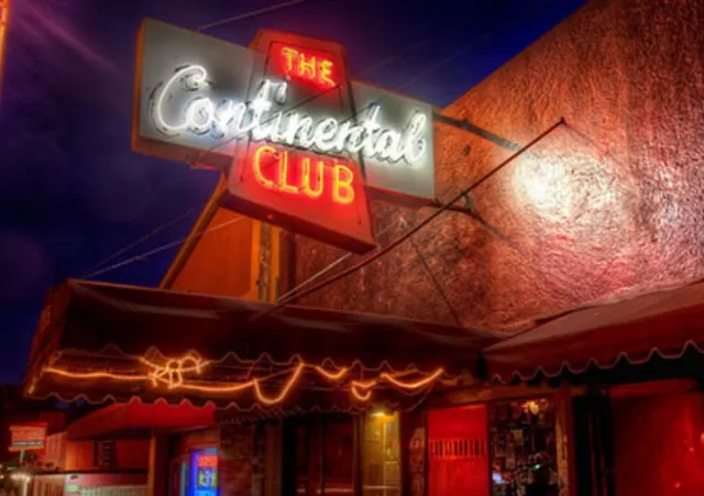 a view of a chair and table in a backyard