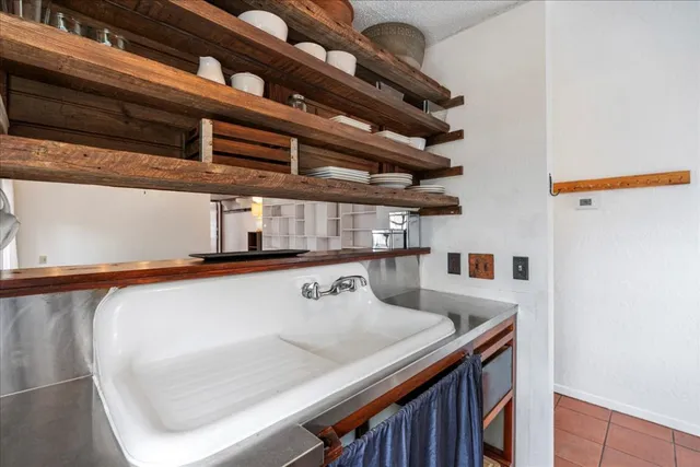 a kitchen with a table and chairs