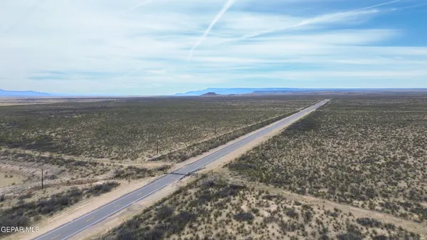 an aerial view of beach and city
