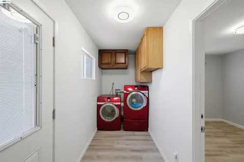 a view of a kitchen with a stove top oven a sink and dishwasher